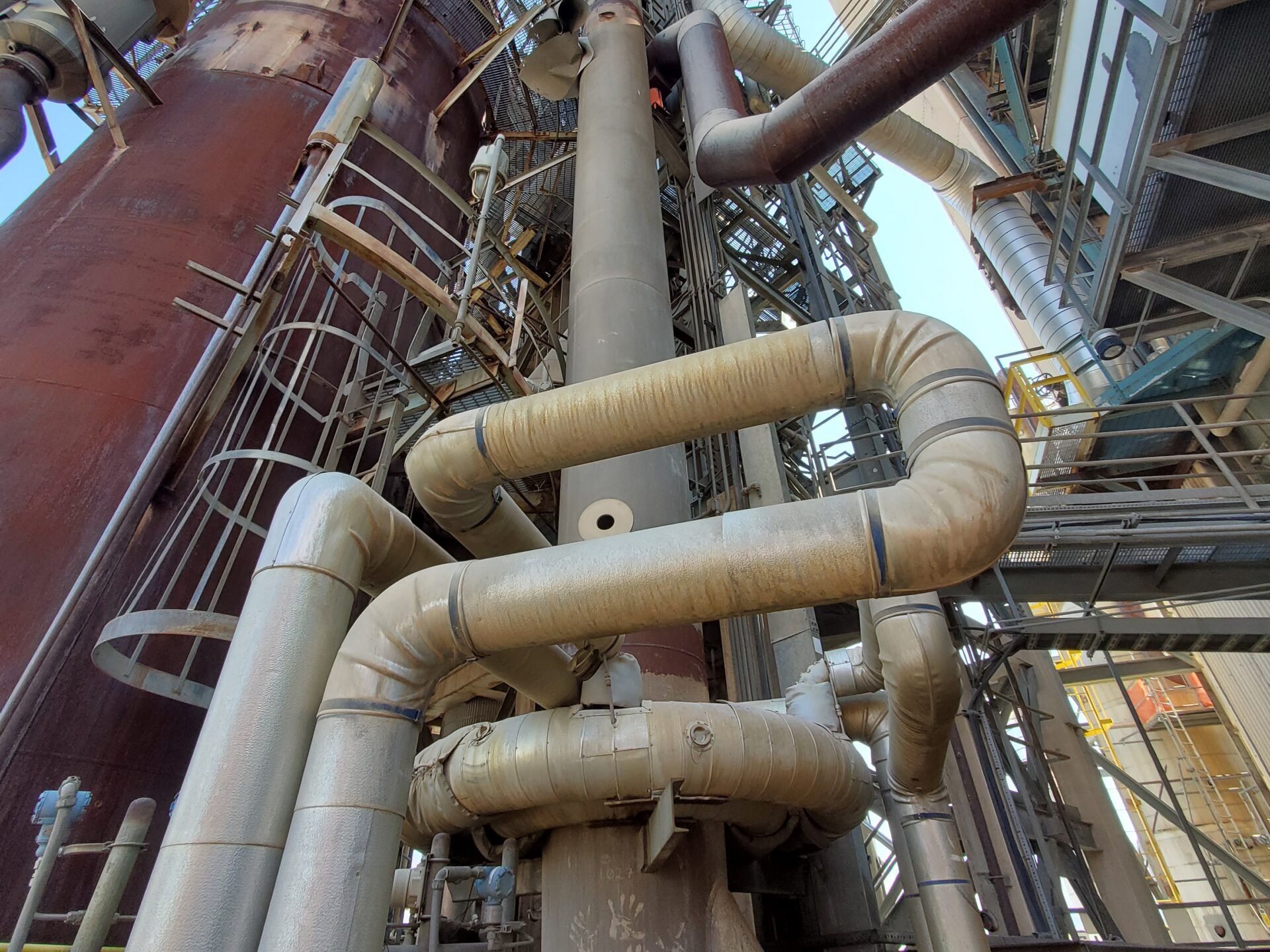 A local refinery planned to replace the catalyst regeneration riser on their FCC unit during turnaround; however, the existing injector piping had become bent and distorted after many years of thermal cycling, which was exacerbated further by bottomed-out spring can supports.